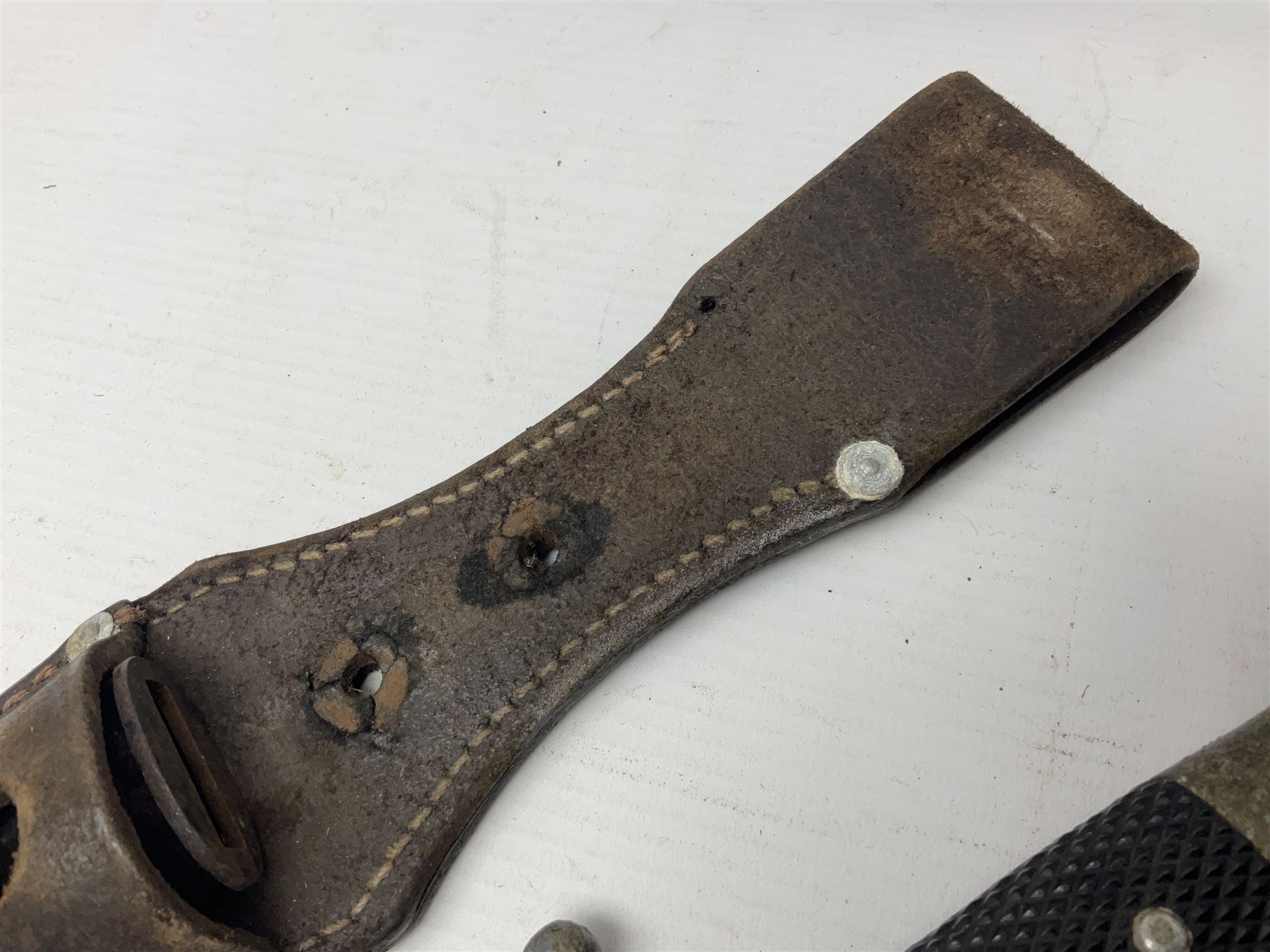 WWII German K98 (short) NCO dress bayonet, the 20cm fullered blade marked Anton Wingen Solingen to the ricasso, with chequered black grip plates; in steel scabbard with indistinctly stamped leather frog |L37cm overall