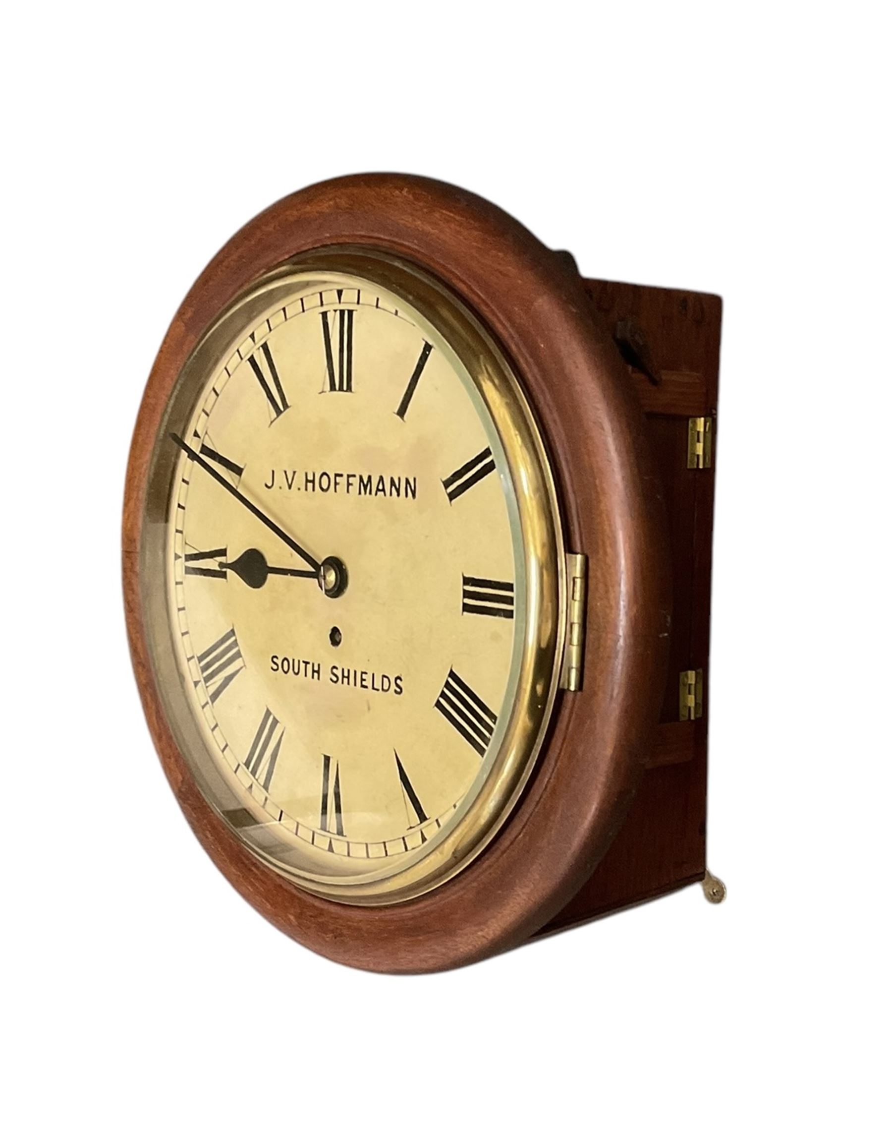 Jens Von Hoffmann of South Shields - Late 19th century 8-day fusee wall clock with a mahogany dial surround and cast brass bezel,  12” painted dial, with Roman numerals, minute track and spade hands,  with a four pillar timepiece chain driven fusee movement. With pendulum and key.
Case with later additions.
