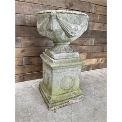 Cast stone centerpiece urn on plinth