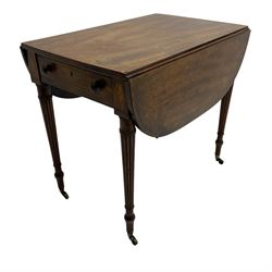 George III mahogany Pembroke table, drop-leaf oval top with satinwood band, fitted with single end drawer, inlaid with satinwood lozenge motifs, on turned and reeded supports with brass cups and castors