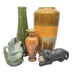 Burmantofts Faience vase, with elongated neck, and concentric circle decoration, in a green lustre glaze, together with a Bretby figure, modelled as a cat with a ball of wool, a Bretby vase, with fluted rim, in orange/red glaze, frog jug and a large West German vase, tallest H38cm