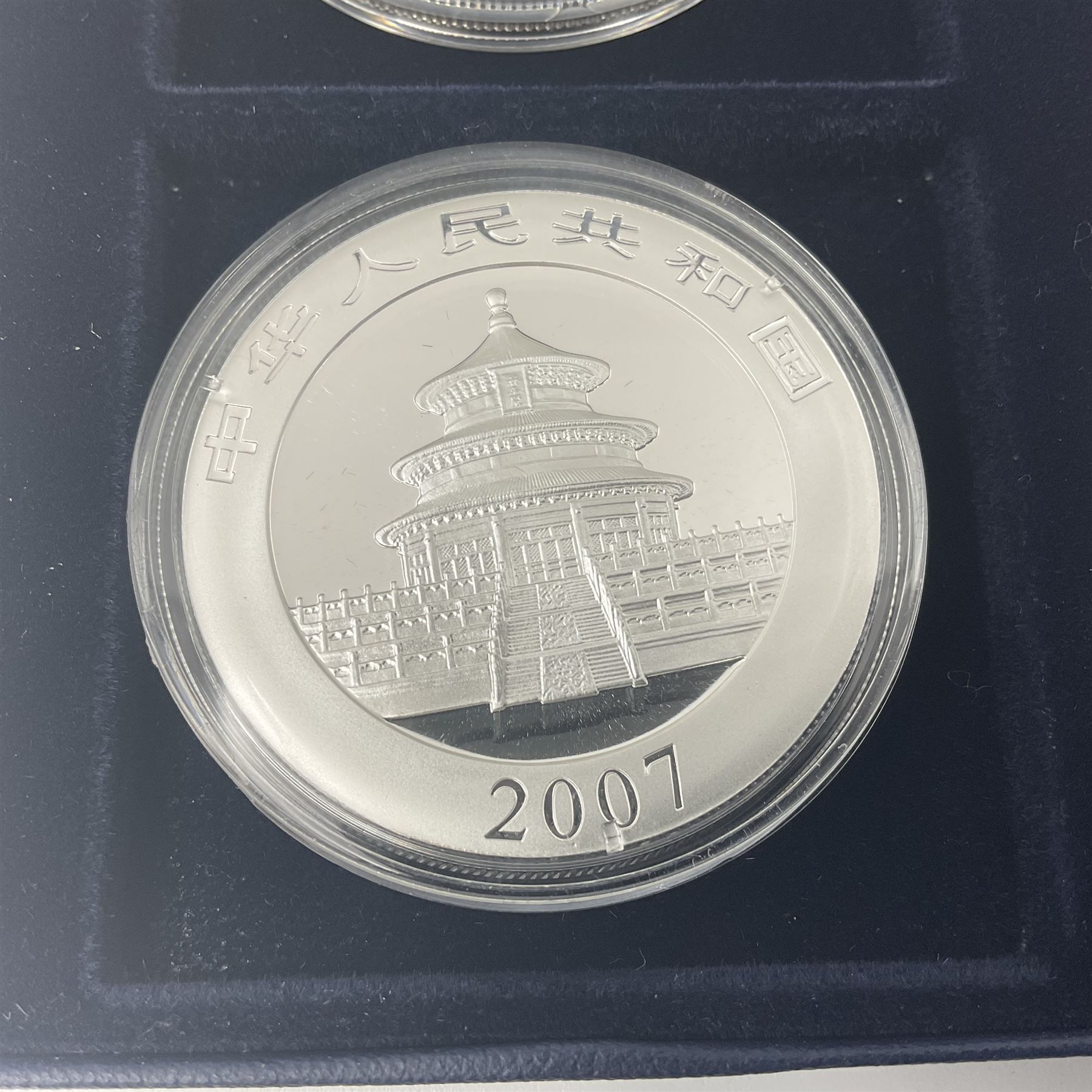 Four one ounce fine silver coins, forming 'The 2007 Famous World Silver Coin Collection', comprising United States eagle, Australian kookaburra, Chinese panda and Canadian maple leaf, cased with Westminster certificate 