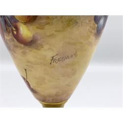 Pair of mid/late 20th century Royal Worcester vases and covers decorated by John Freeman, each of slender ovoid form with twin key and husk handles, and gilt covers, upon a gilt circular pedestal foot, the body hand painted with a still life of fruit upon a mossy ground, signed Freeman, with black printed mark beneath and painted shape number 2713, H25cm