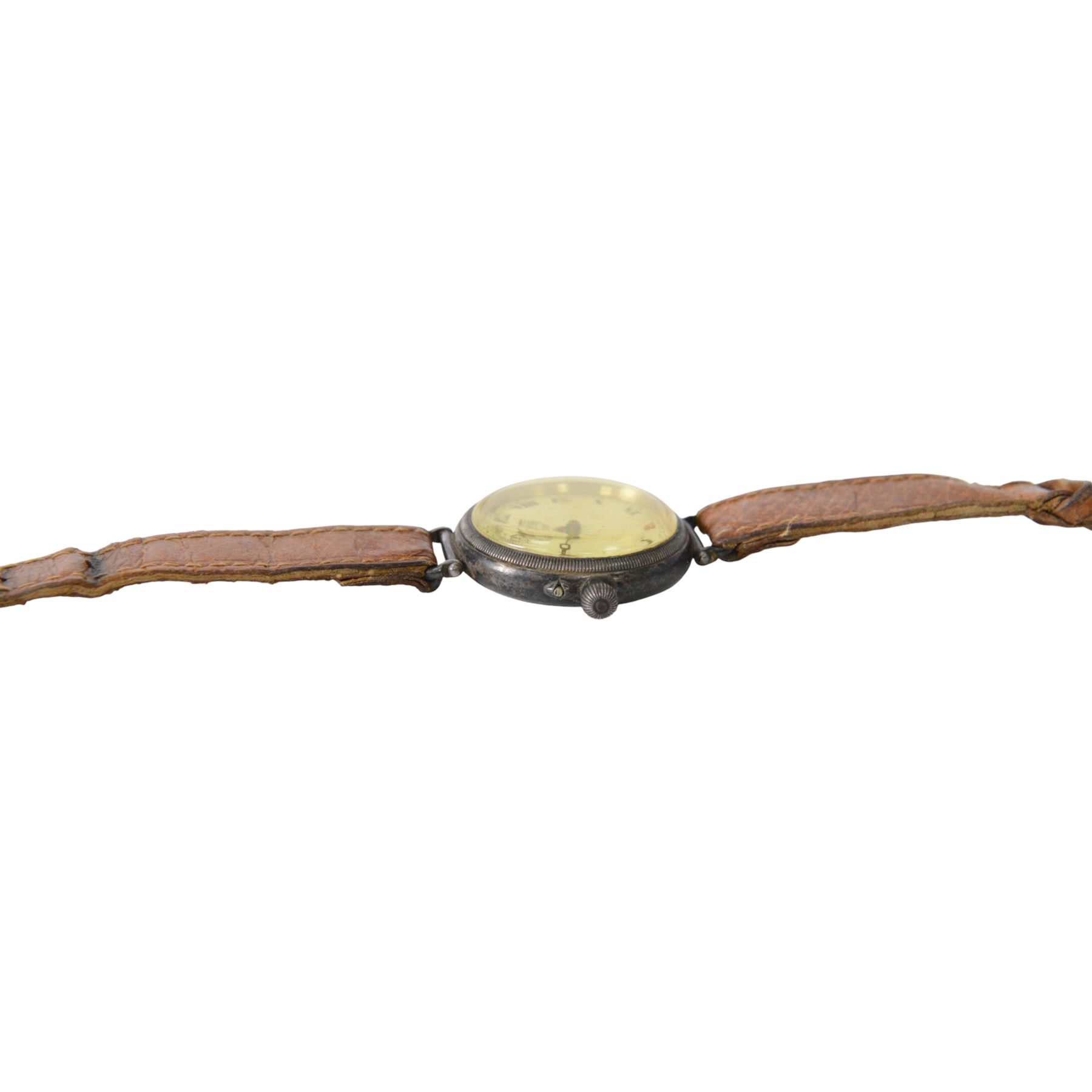 Silver cased trench watch enamel dial with Roman numerals, red XII, Longines movement, used in the Boer war, inscribed to the back 'E M Everitt From W.E Everitt 1882' 