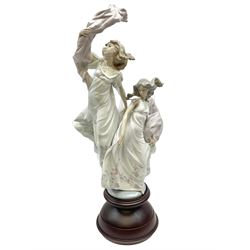 Large Lladro figure, Allegory of Liberty, modelled as two ladies dancing on a mahogany base, with original box, no 5819, year issued 1991, H63cm 