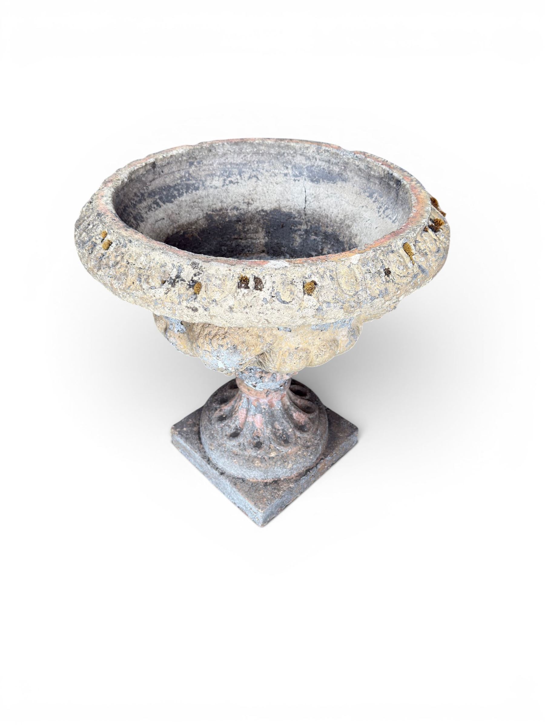 19th century terracotta campana shape urn planter, egg-and-dart moulded rim over a cherub-mask and gadrooned underbelly, turned pedestal and socle on square base