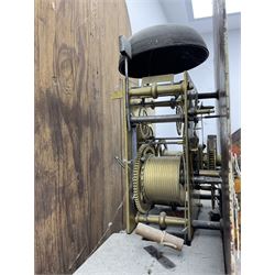 Ayers of Newcastle - 19th century oak cased 8 day longcase clock c1850, with a break-arch top and turned wooden finials, conforming hood door flanked by waisted pilasters and brass capitals, trunk door with an arched top, rectangular plinth with decorative base, painted dial with floral spandrels and a rural depiction to the arch, Roman numerals and minute track, with matching brass hands and subsidiary seconds and date dials, dial pinned directly to a rack striking movement, sounding the hours on a bell. With pendulum and weights.