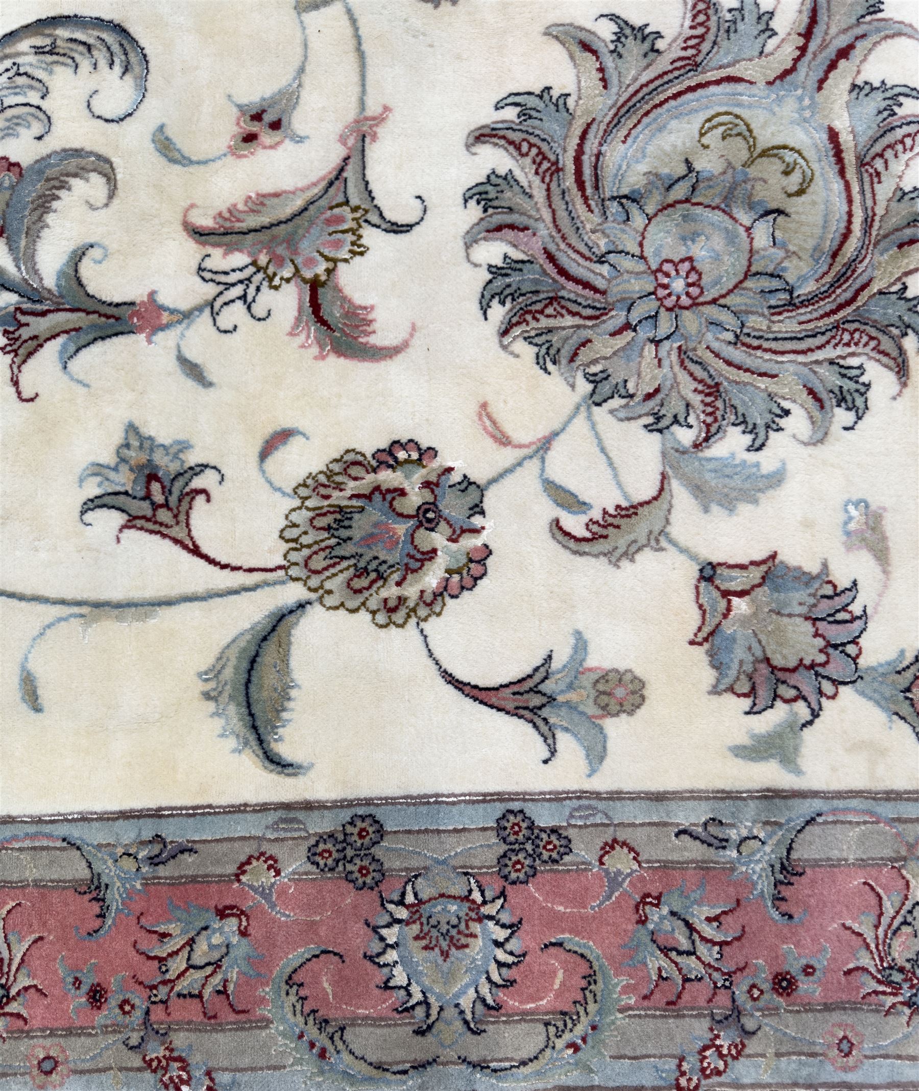 North East Persian Kashmar hand-knotted rug, ivory field with an all-over design of linked floral medallions and scrolling vines with a central circular medallion enclosed by multiple borders and a main broad madder field with palmettes and arabesques, 248cm x 145cm