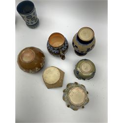 A group of Doulton Lambeth, to include a Slaters Patent tobacco jar and cover, H14cm, beaker with moulded lozenge and flower decoration, H11.5cm, cache pot wit crimped rim, small vase with bulbous body and flared rim, H14cm, etc., all with various impressed and incised marks and makers monograms beneath. 