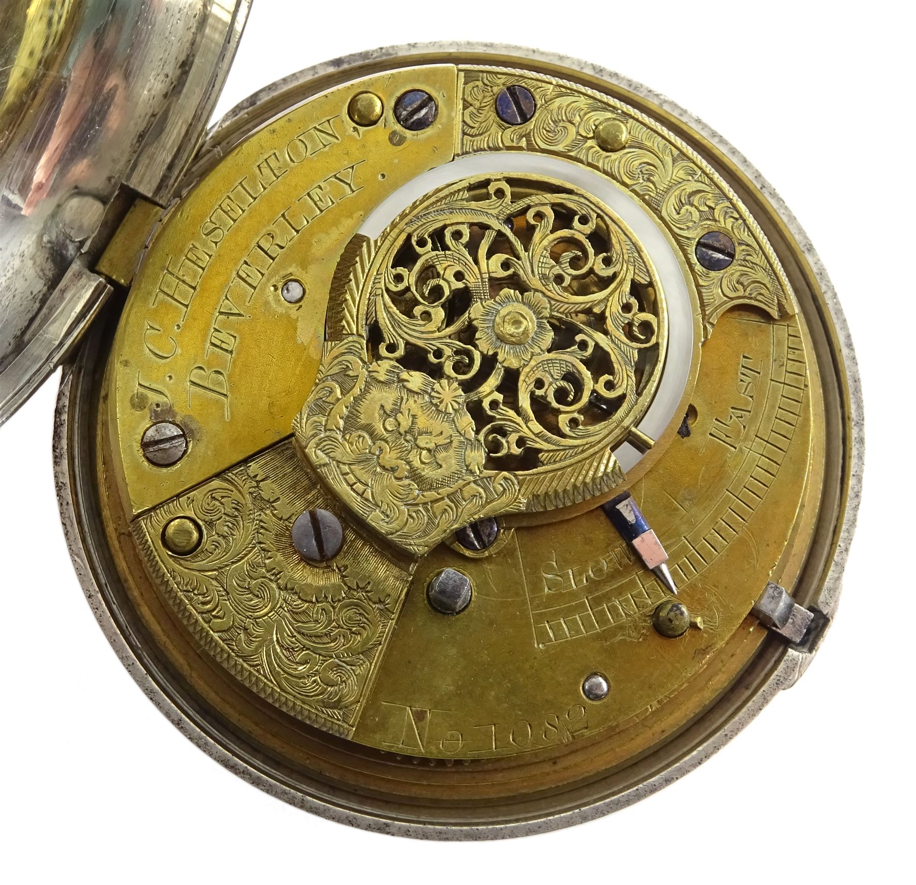 William IV silver pair cased verge fusee pocket watch by J C Heselton, Beverley, No. 1082, pierced and engraved balance cock decorated with a mask, enamel polychrome 'Speed the Plough' dial with Roman numerals, bull's eye glass, case by Benjamin Norton, London 1831