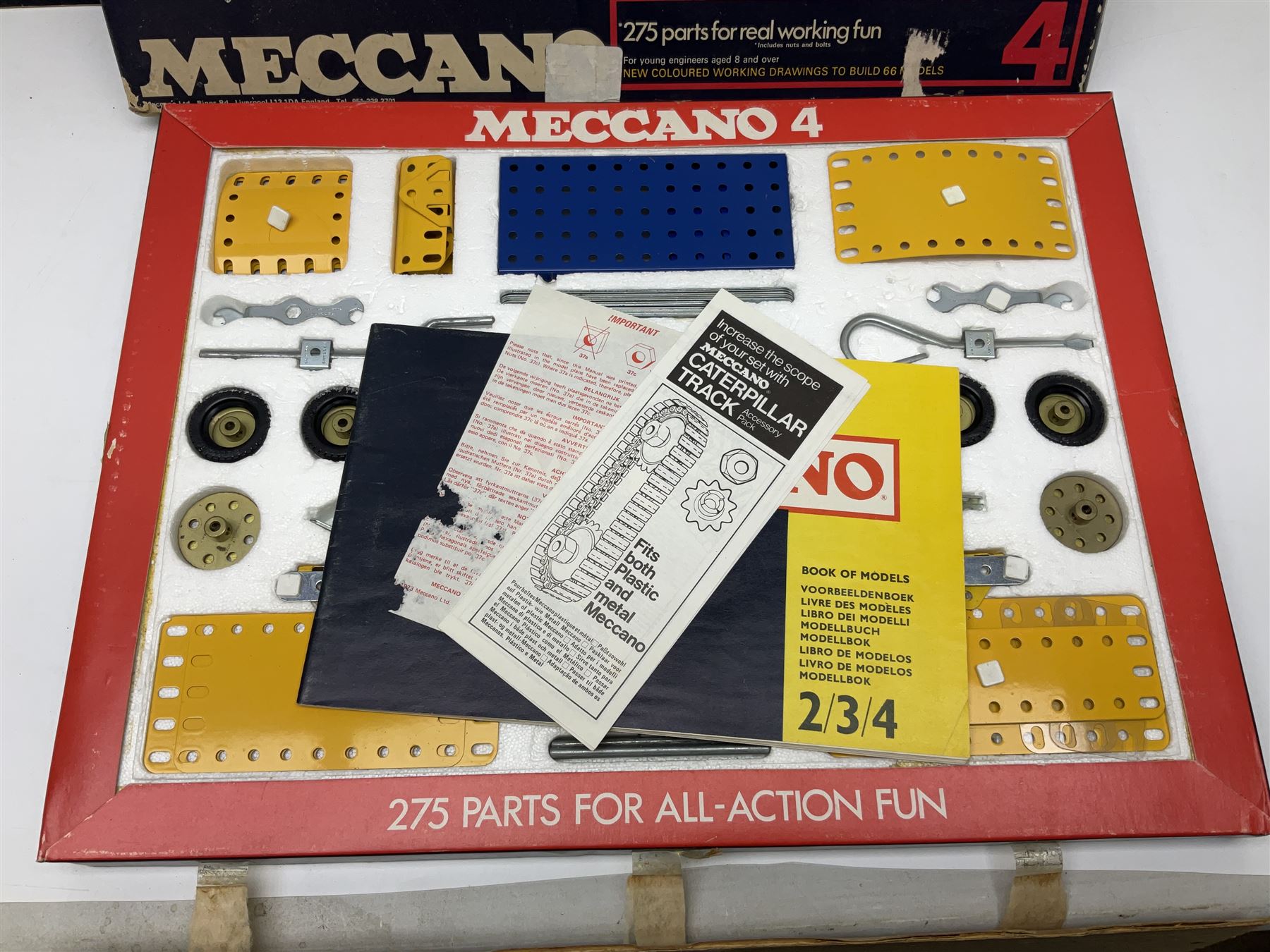 Meccano - Outfits 2, 3 & 4 with blue and yellow parts; look to be virtually complete with most apertures filled; together with a partially stocked Meccano Elekrikit; all boxed with instruction manuals (4)