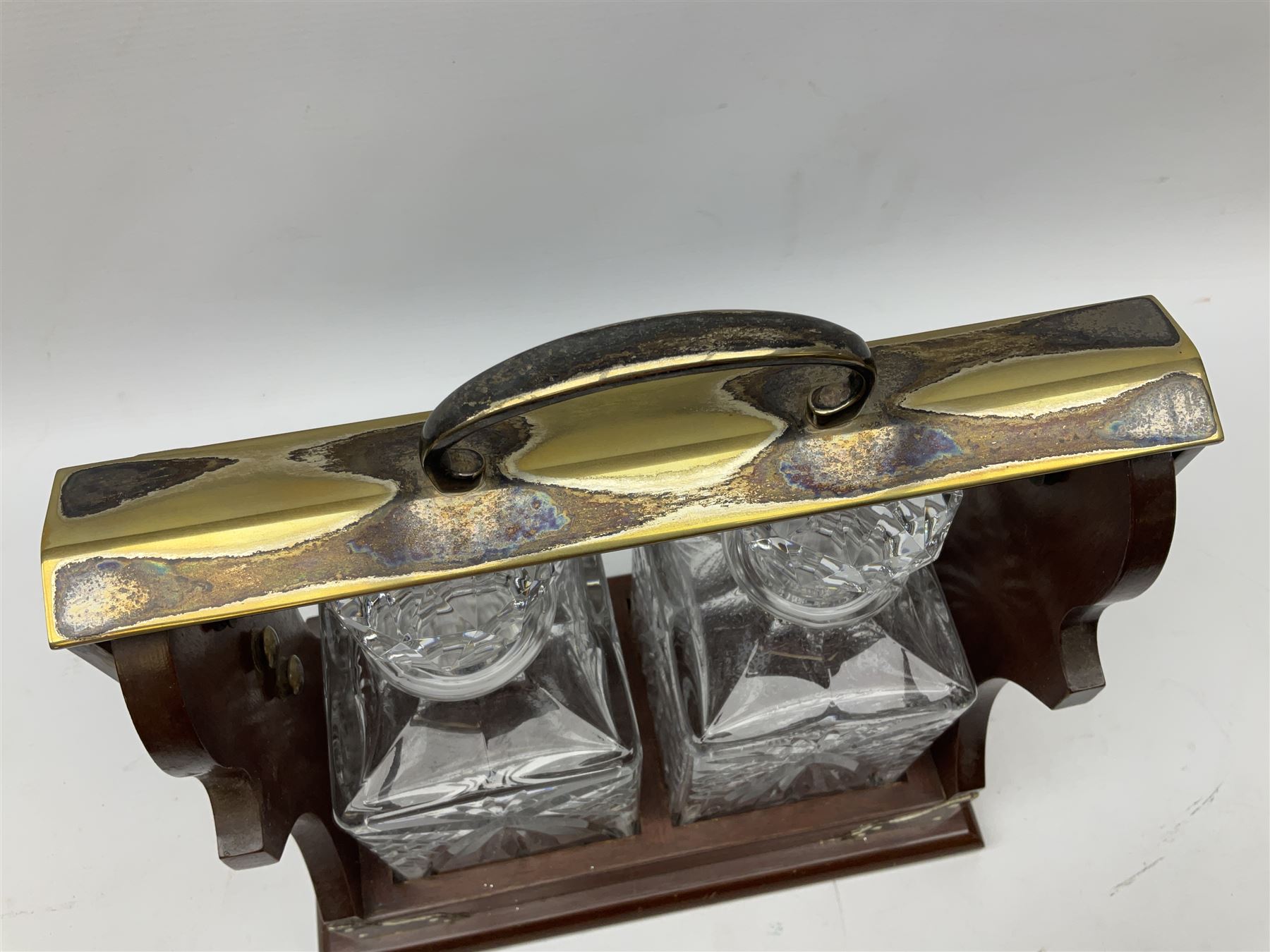 Late 20th century mahogany and silver plated two cut glass decanter tantalus, marked PB&S, with Whisky and Gin Crown Staffordshire ceramic decanter labels, H32cm