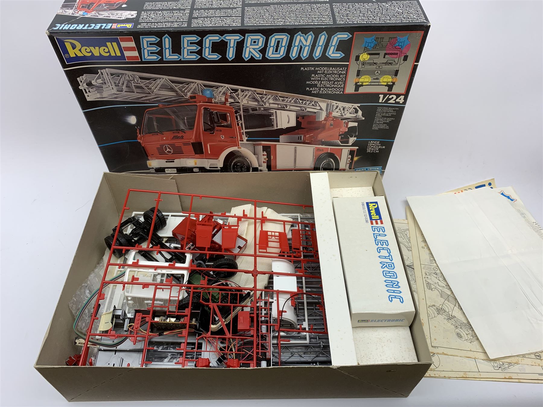 Two Revell Electronic 1/24th scale model kits of fire-engines - Mercedes Benz 1017 LF16 and part constructed Mercedes Benz 1422 DLK 23-12; together with Revell 1/24th scale firemen figures; and Airfix 1/32nd scale model kit of a Dennis Fire Engine; all boxed with instructions (4)