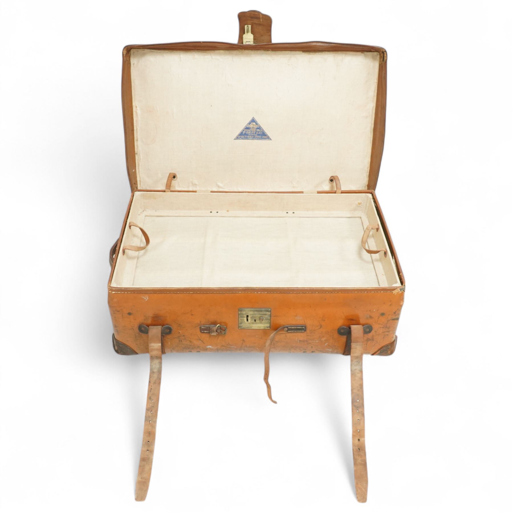 Two late 19th/early 20th century leather travelling 'Ideal' trunks, each stamped and engraved to brass locks F. Best & Co, various travel labels to include the Grand Hotel Naples, Grand Hotel Bellevue, Excelsior Palace Palermo, Waterloo etc, larger suitcase W93cm H32cm D58cm