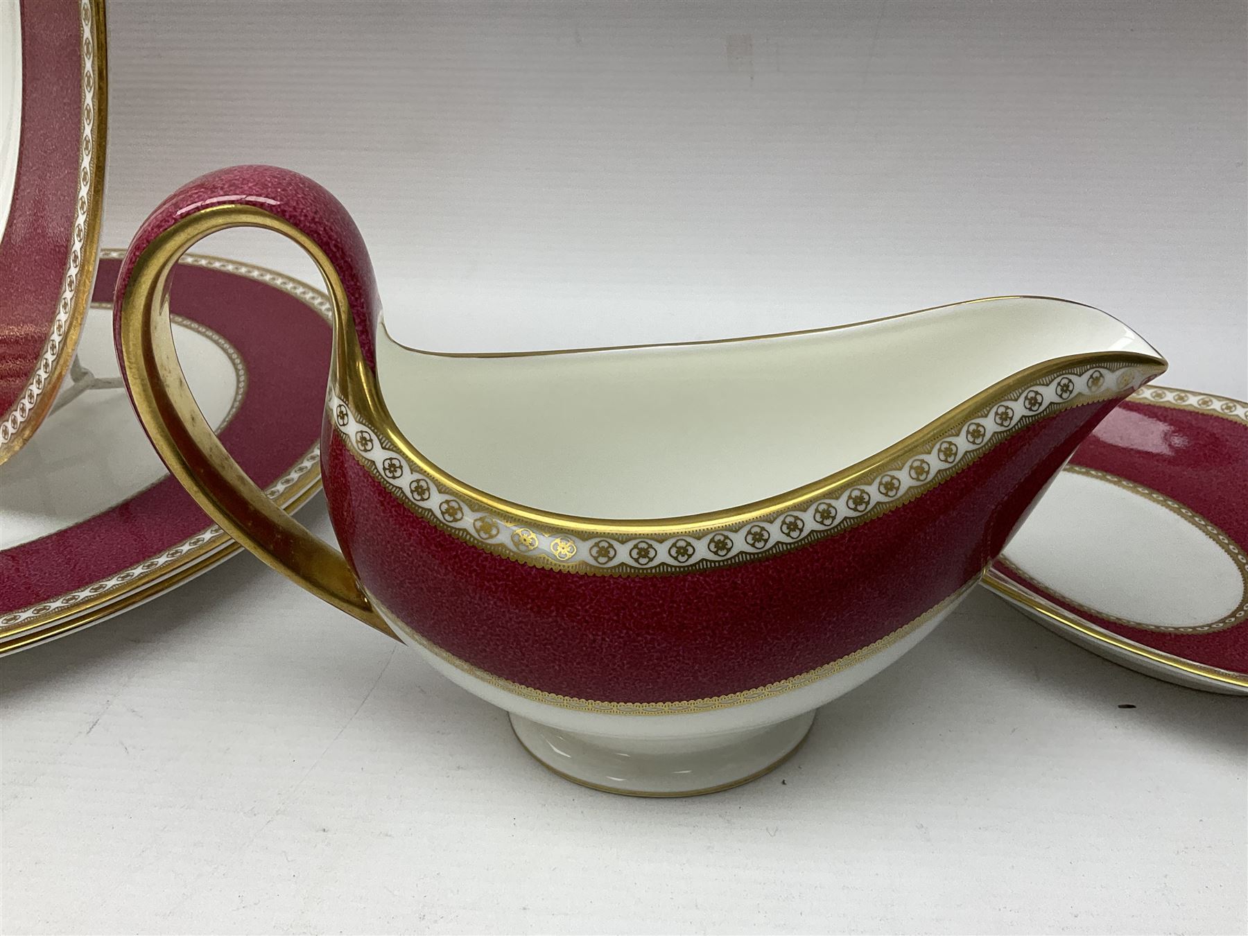 Wedgwood Ulander powder ruby pattern part dinner service, comprising six dinner plates, six side plates, six dessert plates, six soup bowls and sauce boat
