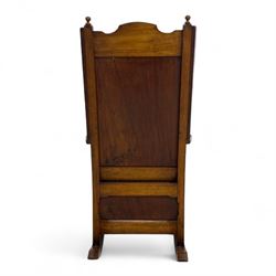 19th-century beech, yew, elm, and mahogany wingback vernacular rocking chair, high back with shaped wings, scroll arms with turned supports, lift-up seat,  square legs on ring turned supports on curved runners 