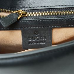 Gucci GG Marmont black matelassé leather top handle bag, made in Italy, with chevron quilted leather and heart motif to the reverse, antique gold-tone Double G front hardware, leather top handle and detachable chain shoulder strap with leather shoulder guard, front flap closure, suede-effect interior with zip pocket and leather logo tab stamped Gucci made in Italy, together with original Gucci dust bag and carrier, W27cm D11cm H20cm