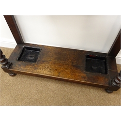  Victorian carved oak hall stand, raised bevel edge mirror back, turned supports joined by a single undertier with two metal umbrella trays, W122cm, H199cm, D32cm  