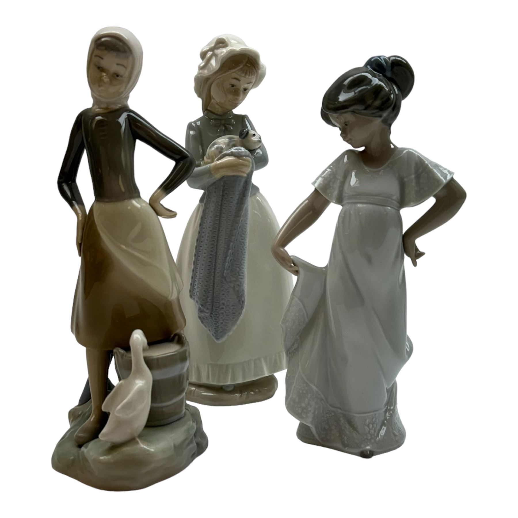 Four Lladro figures, including Market Day no 4502, Girl with Milk Pail no 4682 etc, together with five Nao figures and one other 
