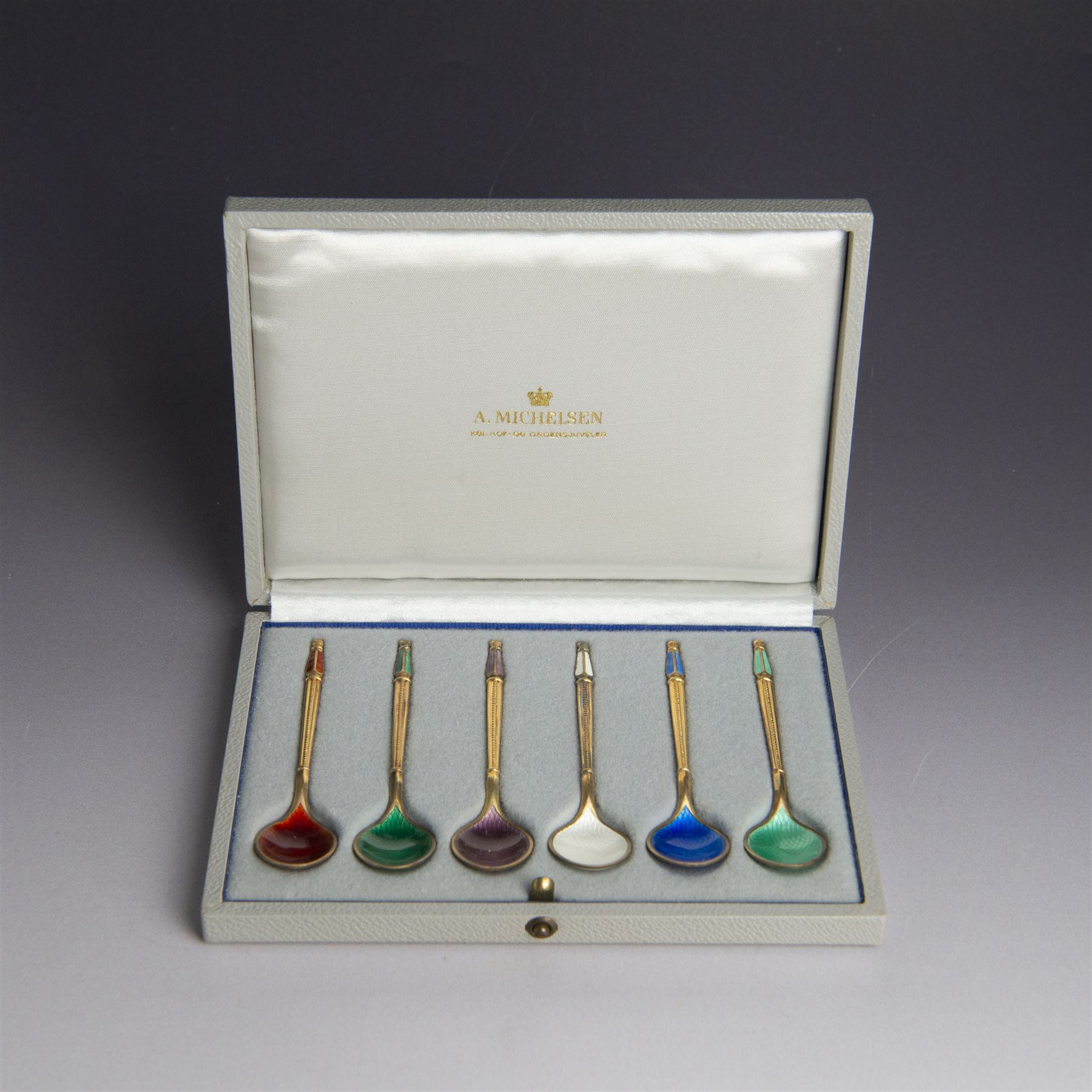 Set of six Danish silver-gilt and guilloche enamel demitasse spoons by Anton Michelsen, stamped A. Michelsen, Sterling, Denmark, with import marks for London, R C P Ltd, in fitted case