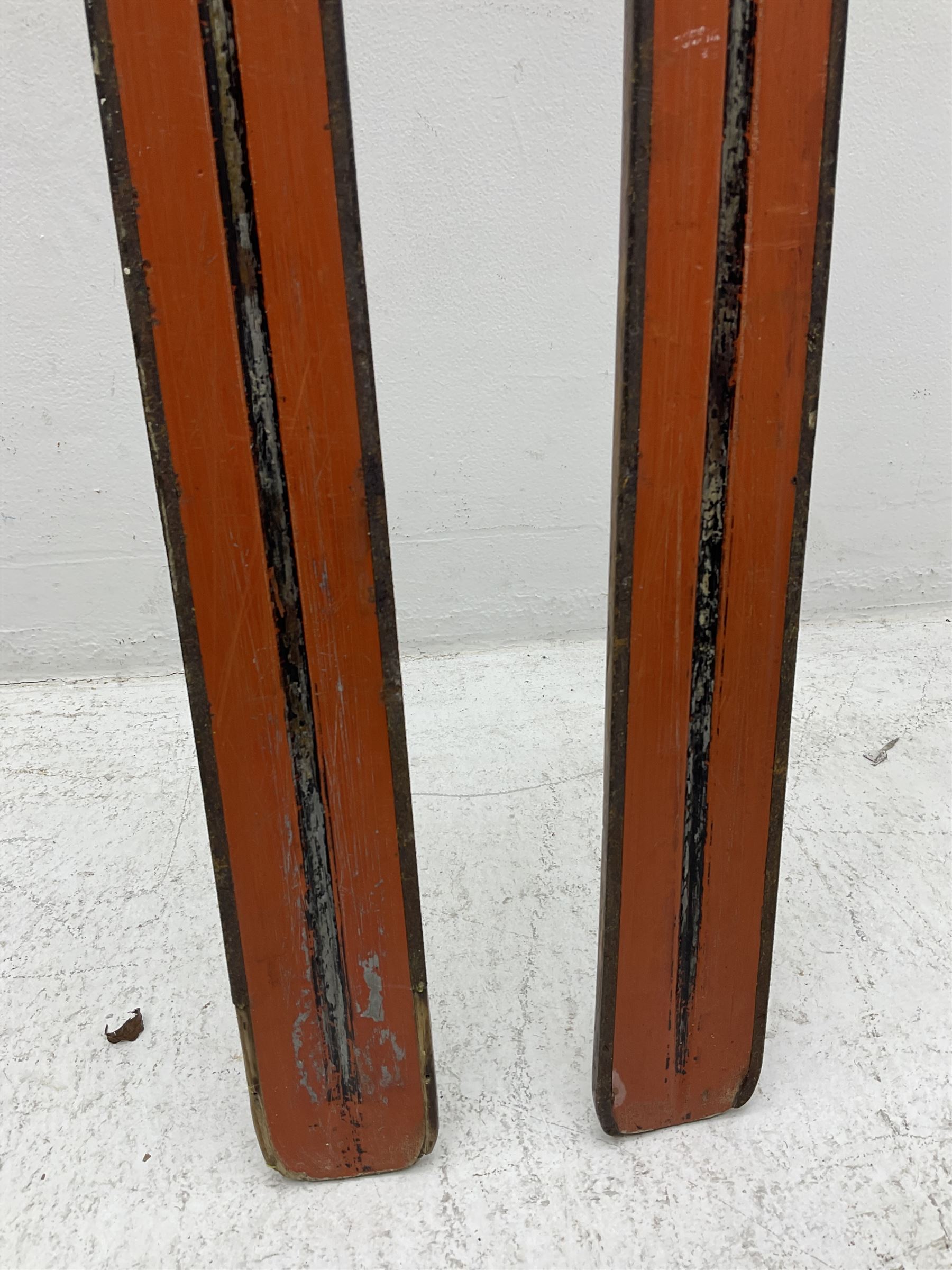 Pair of 1930s wooden skis, with painted metal runners beneath stamped Attenhofer, with retailers label for Ernst Gertsch Central Sports, L206cm