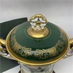 Aynsley twin handled racing cup and cover, to commemorate 'The Golden Jubilee of the Revival of The Yorkshire Cup', the handles inscribed '1927' and '1977', the green body painted by E. Woodhouse with Joe Childs up on Trimdon, the reverse with the winners, the domed cover with a Yorkshire rose finial, limited edition no. 4 of 50, on hexagonal wooden base with certificate, H34cm
