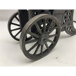 Victorian cast-iron and steel signal cannon, approximately half-inch bore, with 23cm ringed barrel and cylindrical trunnions, on a cast iron carriage with two twelve-spoked wheels and guilloche pierced swept back support, L43cm overall
