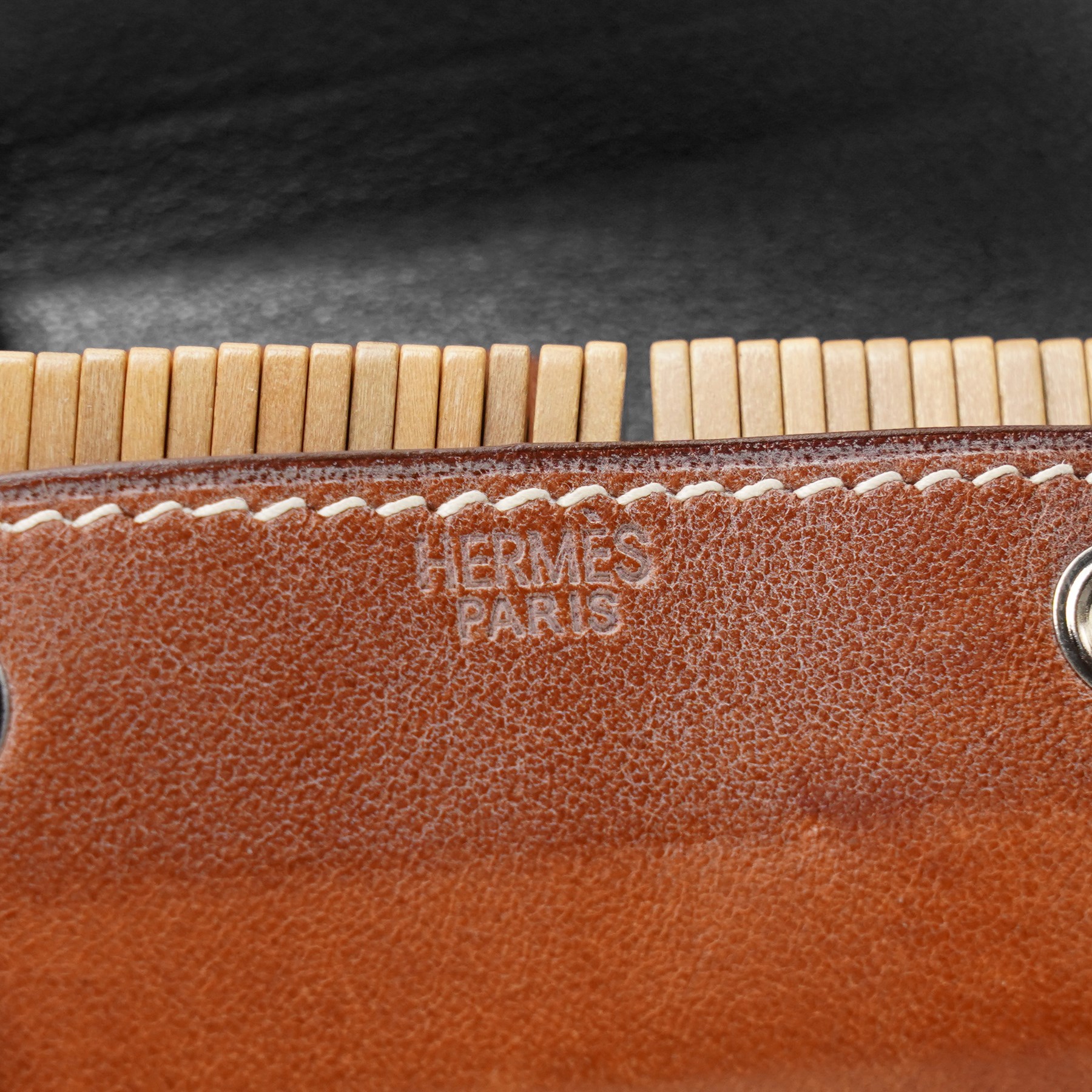 Hermès - ‘Mini-Dominos In-the-Pocket’ game, comprising miniature domino set in tan leather press-stud case, with original box and booklet