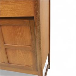 Nathan - mid 20th century teak sideboard, fitted with three drawers with brass ring handles, above a central fall front cabinet, flanked by two cupboard doors, raised on square tapering supports
