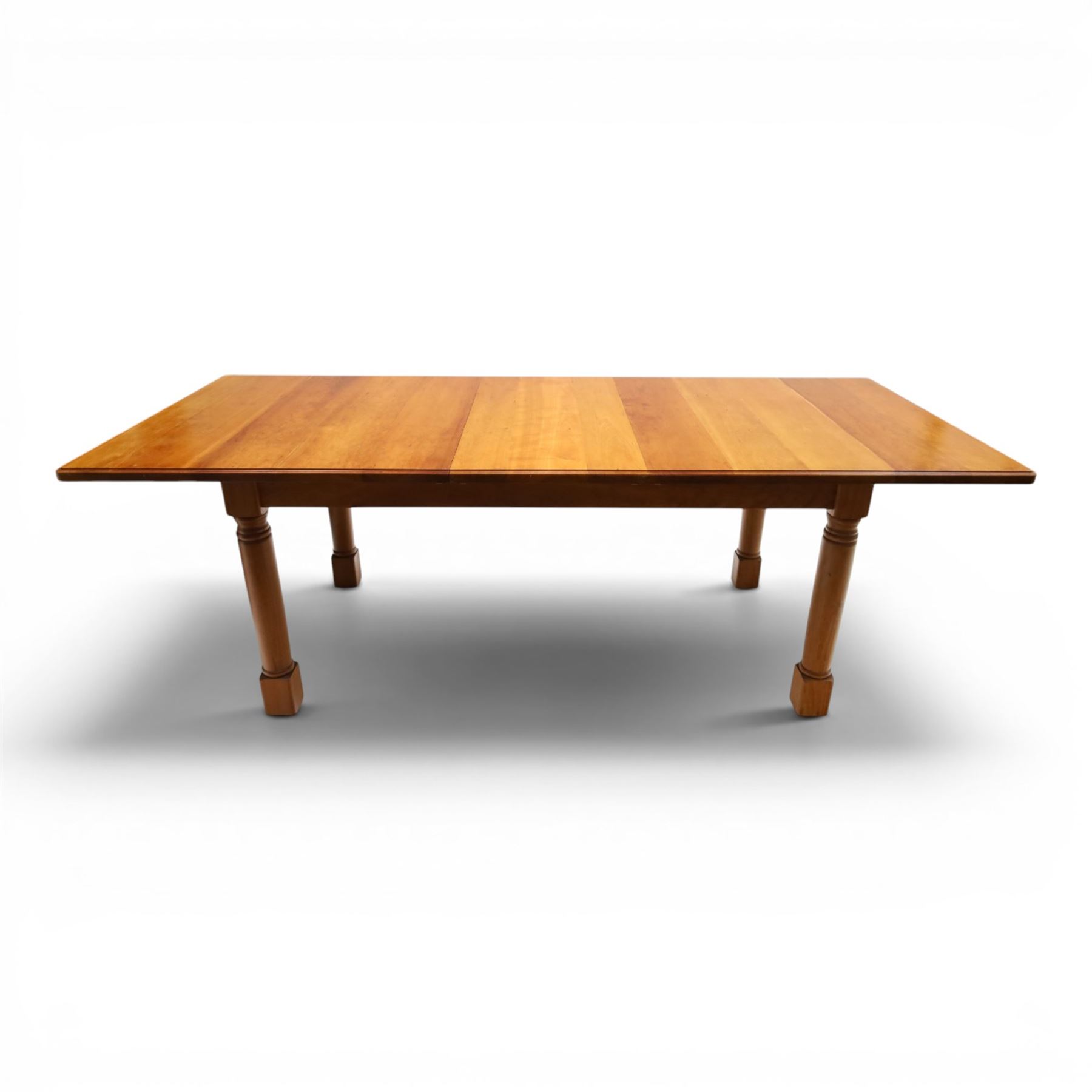 Knightman - cherrywood extending dining table, the rectangular top raised on four turned legs, with additional leaf extending to 230cm total, recessed carved knight trademark, by Horace Knight of Old Mill Furniture, Balk near Thirsk