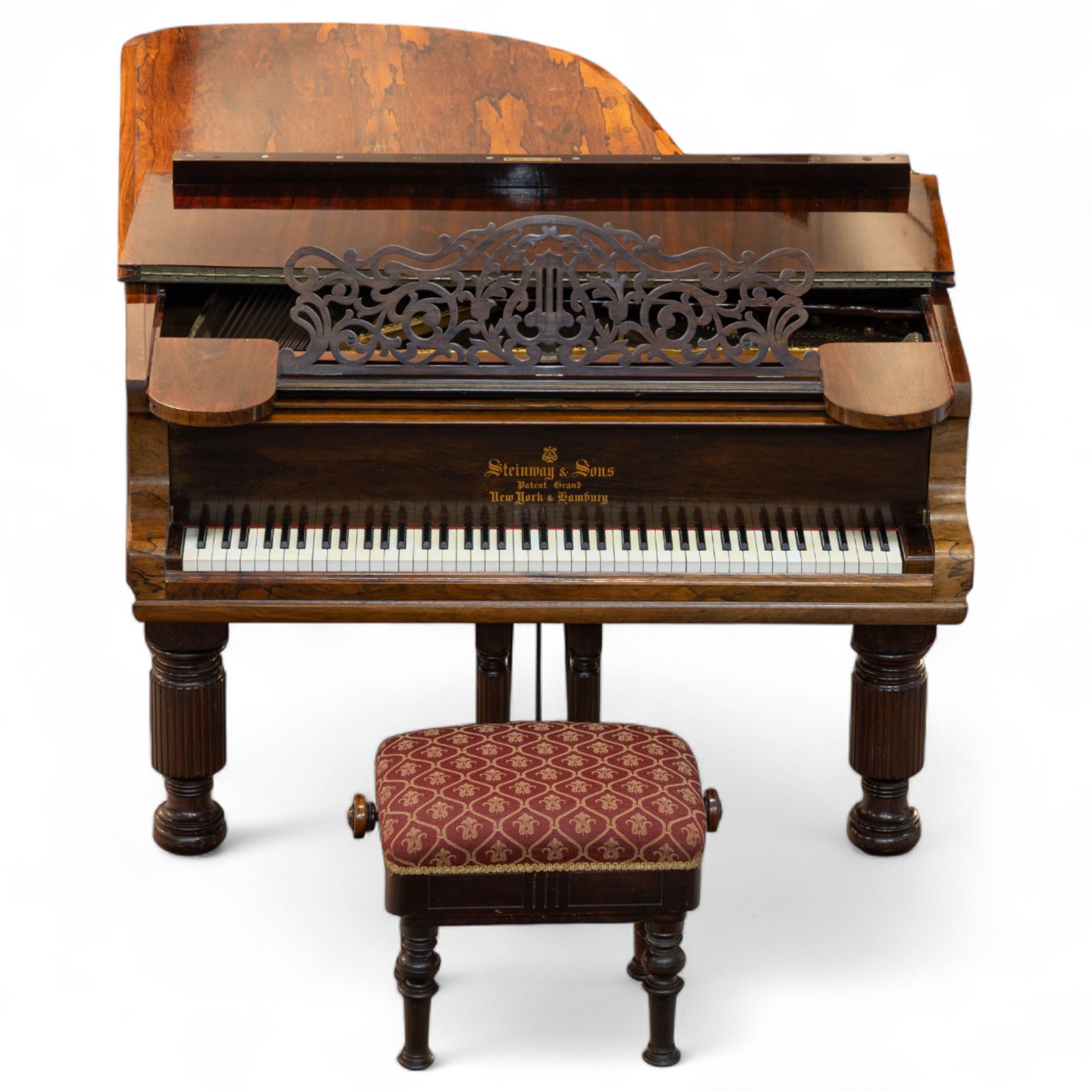 Steinway & Son, New York & Hamburg- Model B, overstrung Drawing Room Grand Piano in a rosewood case, Serial No 87297 (1896/7), with 85 ivory covered and ebony keys A0-A7(7 octaves) with an adjustable fretted music desk, brass fittings and pedals, Steinway “Fireplug” straight columnar and fluted legs with roller castors and conforming lyre, duplex stringing with agraffs, bass strings copper wound with a steel core, steel tuning pins, original Steinway action, hammers, keys, felts, and dampers, with una-corda, sostenuto and sustain pedals, Overstrung iron frame detailing numerous Steinway patents, awards, and features. Tuned to Concert pitch (A=440). 
With an adjustable single stool. 

This item has been registered for sale under Section 10 of the APHA Ivory Act HLB1KY67