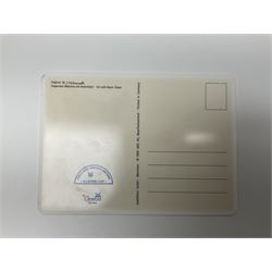 Two ceramic Hummel postcards by Goebel, both displayed on wooden easels, together nine Hummel eggs, set of four Hummel School Days plates, on wooden hanging rack, Goebel Collectors Club Member plaque etc