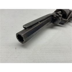 Mid-19th century Smith London .36 cal. transitional five-shot percussion revolver, the 12cm rifled octagonal barrel with side loading lever, side safety, some engraved decoration and chequered two-piece grip L28cm overall