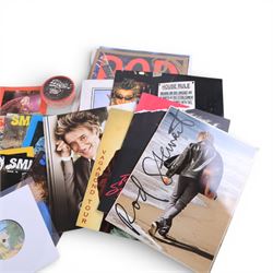 Signed bottle of Rod Stewart edition Wolfie's blended scotch whisky, together with Rod Stewart memorabilia, including first edition of his autobiography, colour photograph and two 7 inch singles, DVD sleeve 'Rod Stewart Live at Royal Albert Hall' signed by both Rod Stewart and Penny Lancaster, framed, tour programmes including 2019 world tour and a collection of Fan Club magazines