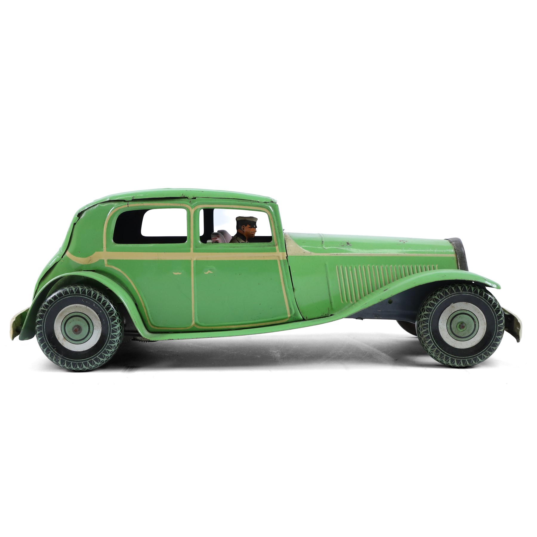 Mettoy large scale tinplate clockwork limousine, circa 1940, with green body and cream lithographed details, red interior with driver, fixed key mechanism, H13cm, L35cm