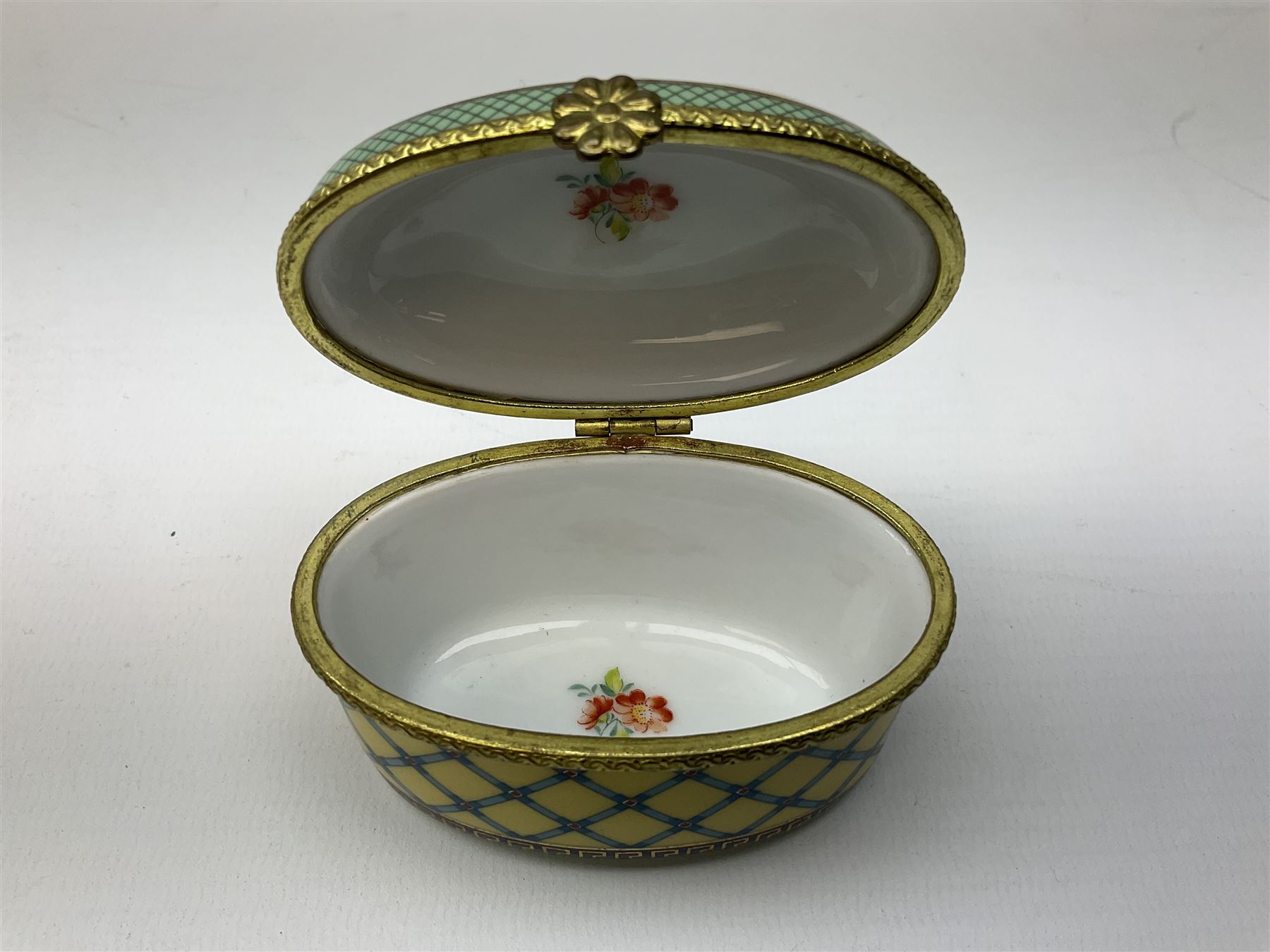 Late 19th Century pot lid bearing ‘The Residence of Anne Hathaway, Shakespeare’s Wife’ below printed decoration of thatched houses and animals scene, Royal Crown Derby Chinoiserie pattern coffee can and saucer, Rd No 758225, and an oval trinket box with gilt decoration bearing interlaced L mark to base (4)