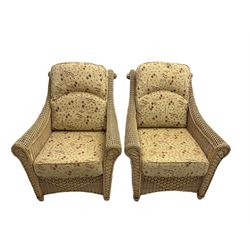 Four piece cane conservatory suite - two seat sofa (W130cm), pair of armchairs (W85cm), and coffee table (85cm x 60cm)