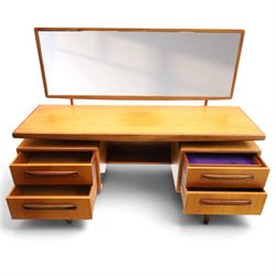 G-Plan - ‘Fresco’ teak dressing table, rectangular top with raised rectangular mirror, fitted with four drawers arranged as twin pedestals with sculpted handles, central knee-hole, on tapering supports