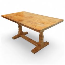Mouseman - figured oak 5’ refectory dining table, rectangular top with burr figuring, raised on chamfered octagonal supports united by a stretcher, carved mouse signature to leg, by the workshop of Robert Thompson, Kilburn