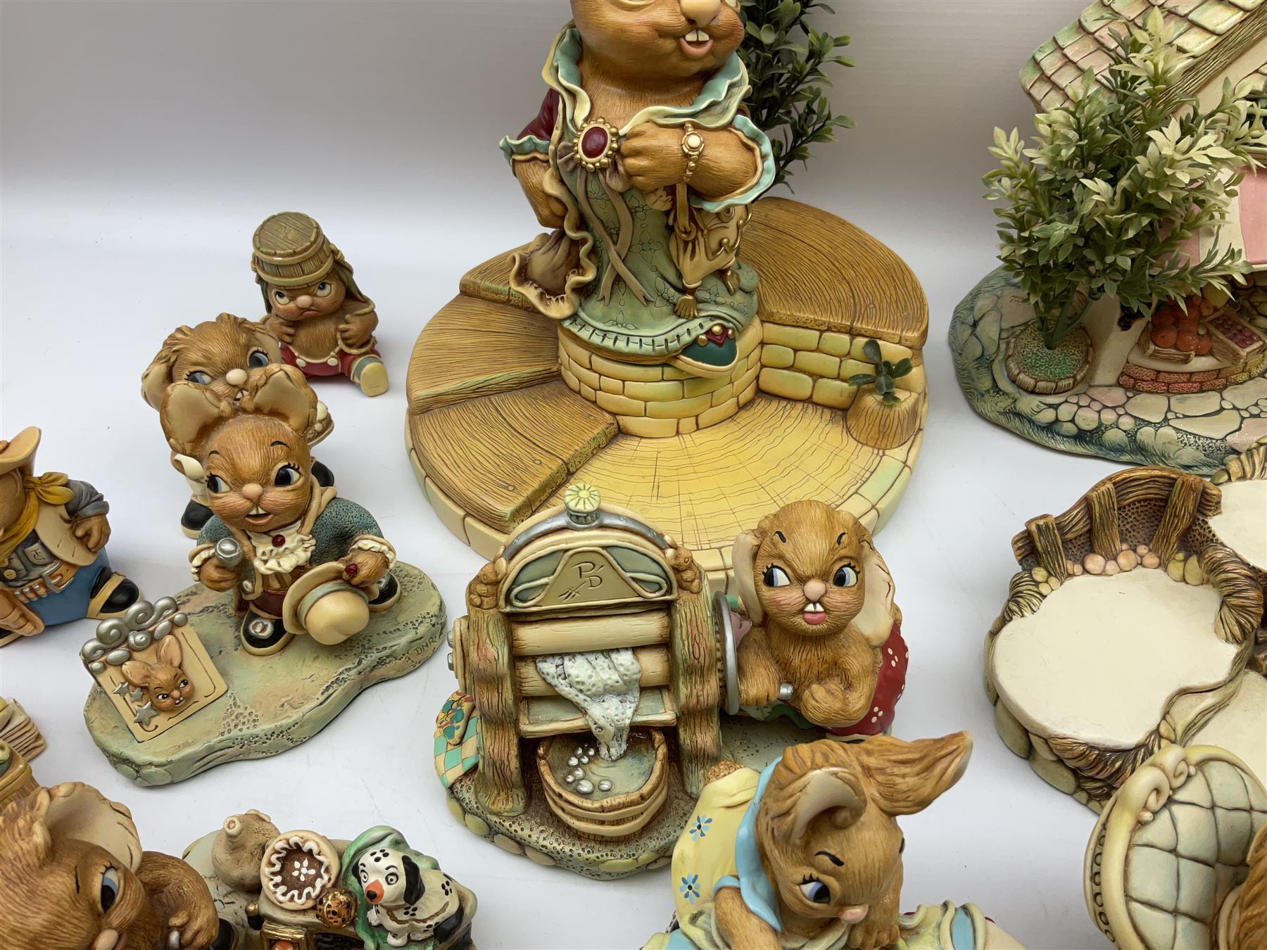 Extensive collection of Pendelfin rabbits and stands, to include Betsy Barge, Fruit Shop, Uncle Soames, Event Piece etc, many with original boxes 