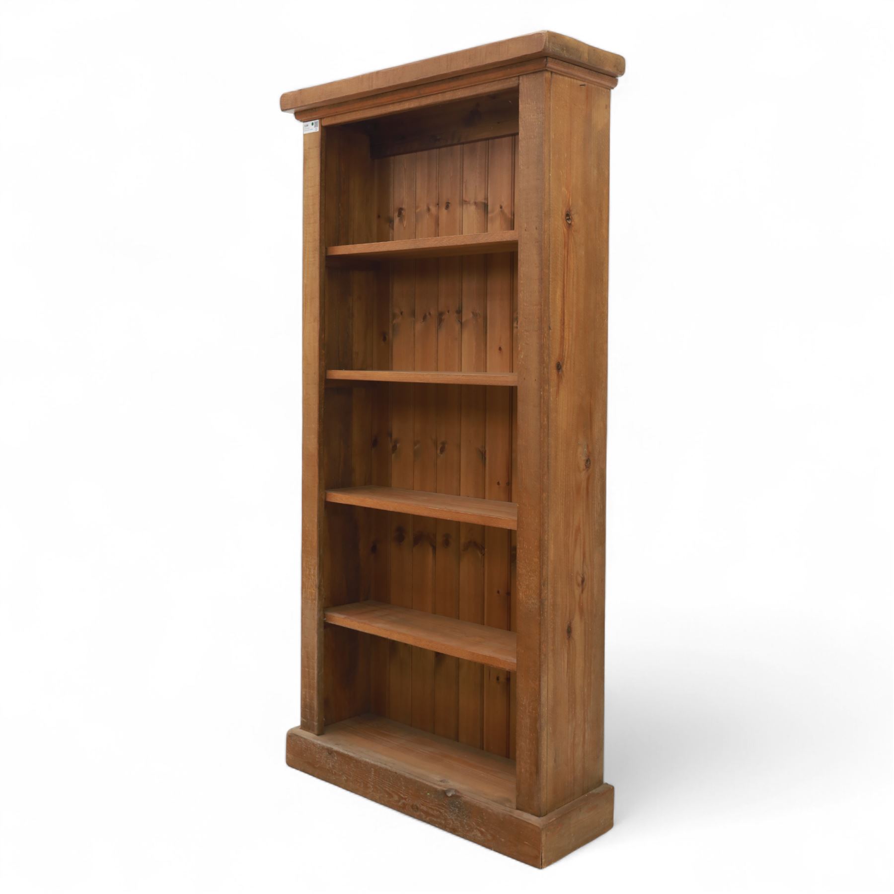 Contemporary oak open bookcase, with moulded cornice above five fixed shelves and boarded back, on plinth base