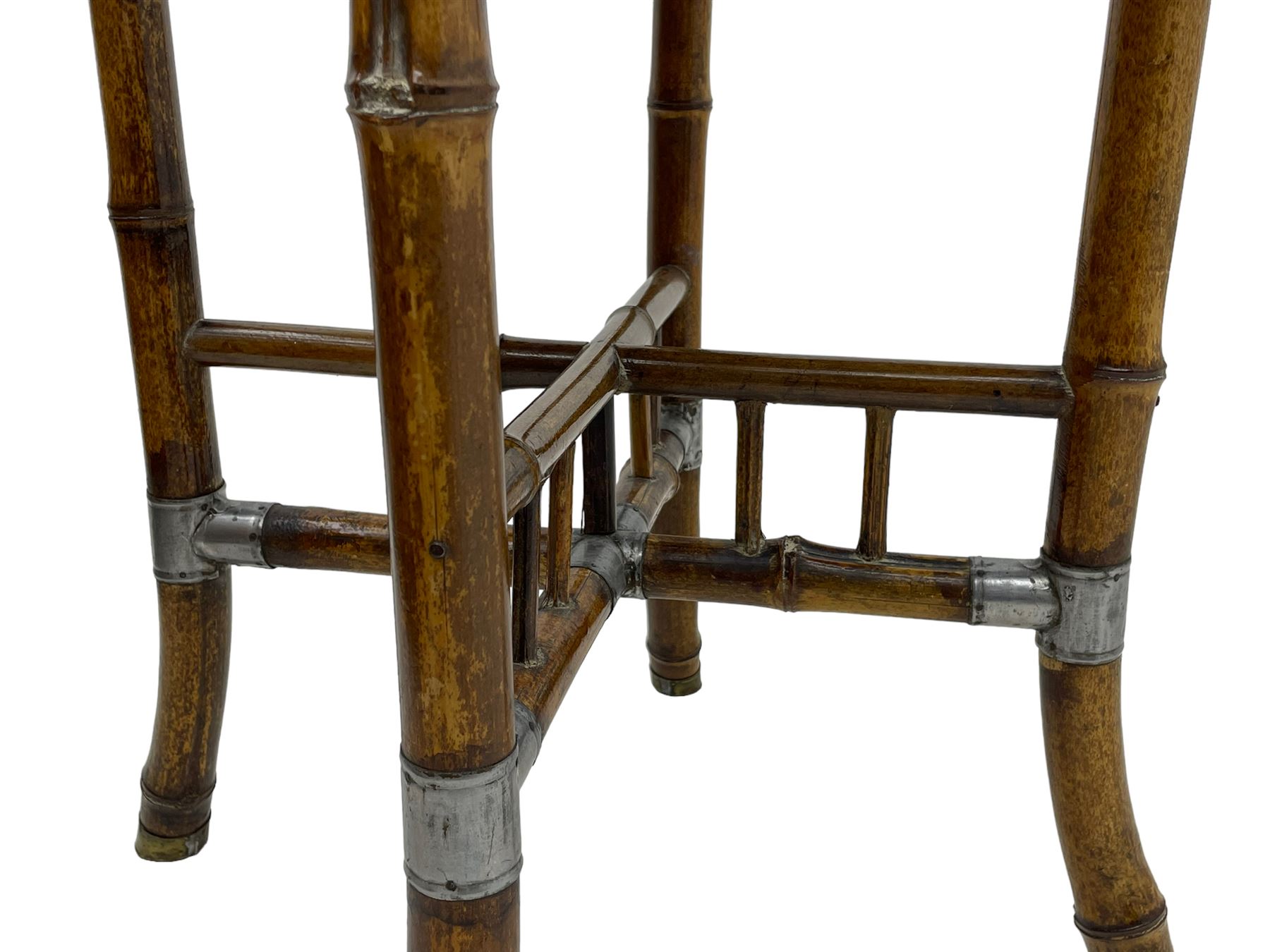 W.F. Needham - Victorian bamboo occasional table, octagonal lacquered top, the bamboo joined by metal brackets, brass cups stamped 'W.F Needham'