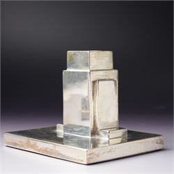 Pair of Art Deco silver candlesticks with square section stems supported by two lappets on a rectangular base H7.5cm x W9.5cm Sheffield 1935 Maker Walker & Hall