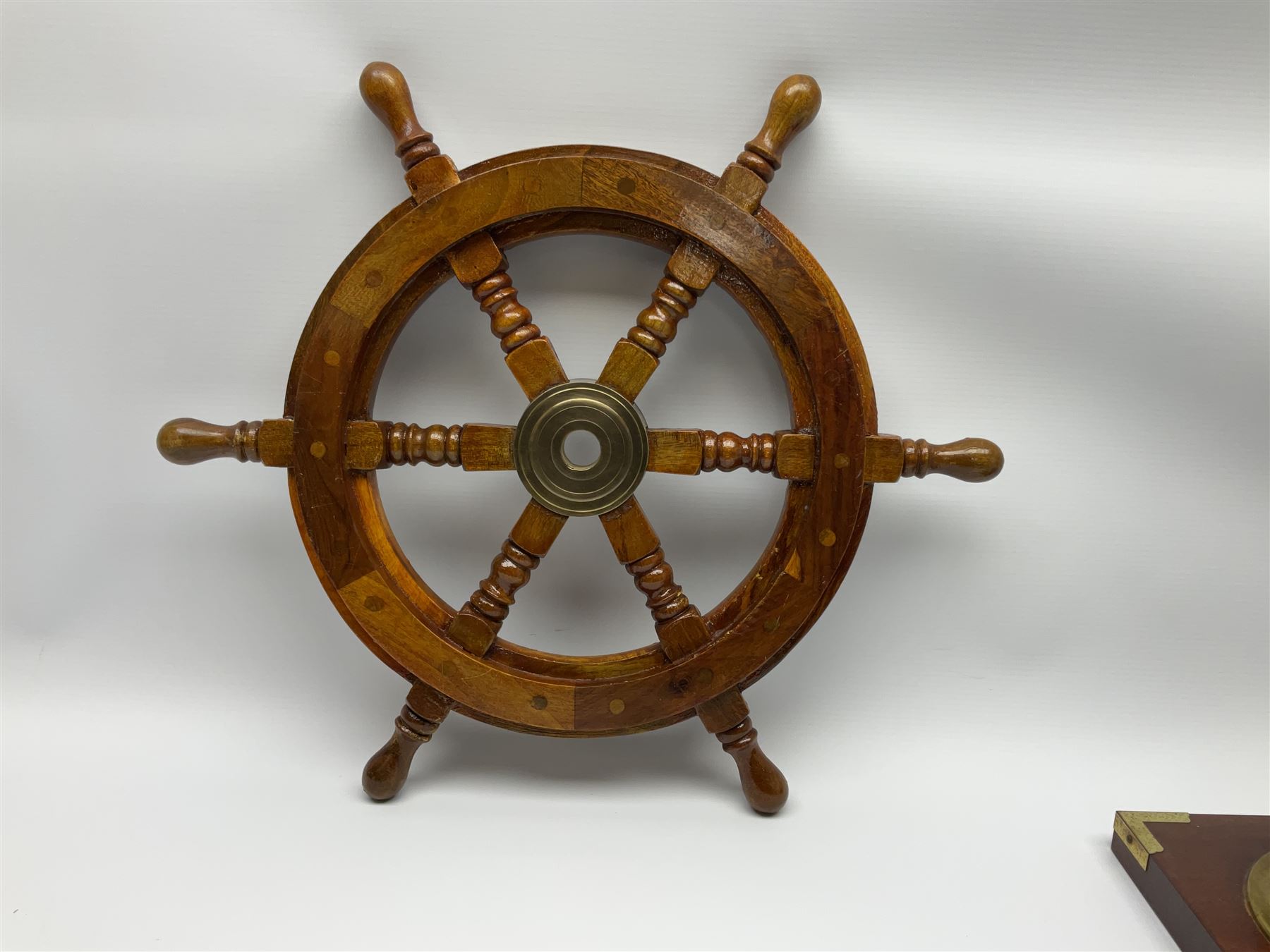 Wall hanging Spectrum quartz clock and Weathermaster barometer, together with six turned spokes ship wheel with brass central boss, D48cm