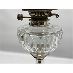 20th century Hawksworth, Eyre & Co silver plated oil lamp, the octagonal stepped base with engraved dedication, leading to an octagonal column supporting a faceted clear glass reservoir, Hinks Duplex burner, clear glass chimney, and cranberry glass shade, overall H71.5cm
