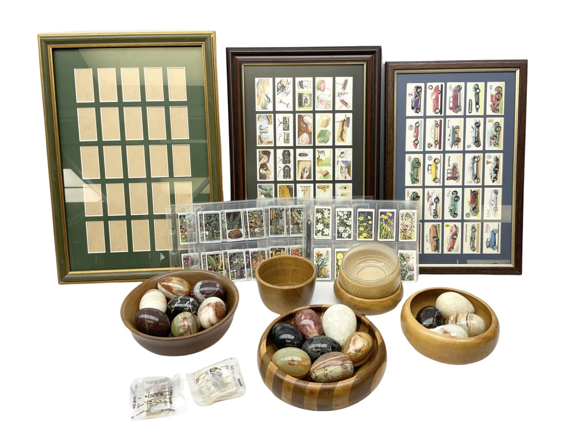 Quantity of cigarette cards to include three frames, and quantity of marble and agate eggs, turned wood bowls etc