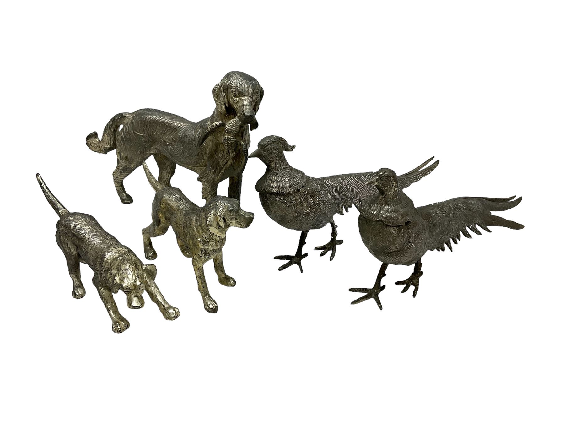 Pair of white metal pheasants, together with three metal figures of dogs, tallest H16cm