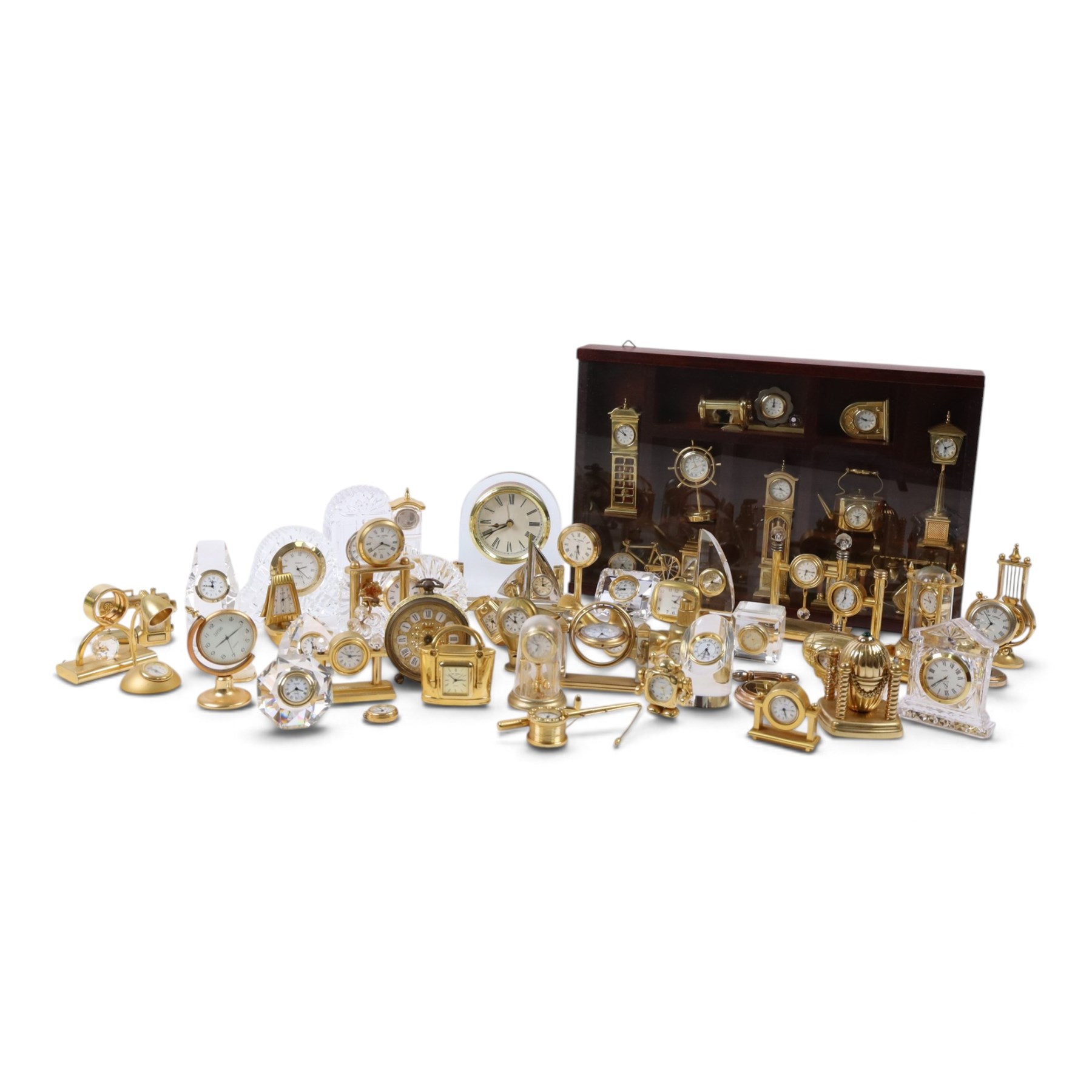 Large collection of miniature novelty clocks, including examples modelled as ships, a lamp, handbag, sewing machine, lamp etc 