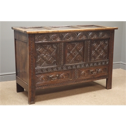  18th century heavily carved oak mule chest, panelled lid, lunette and chip carved front, two drawers, on stile supports, W123cm, H82cm, D49cm  
