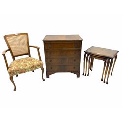 Mahogany four drawer chest, mahogany nest of three tables and a beech framed cane back chair